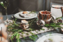 Fotografia Festive Christmas And New Year Table Setting In Scandinavian Style With Rustic Handmade Details In Natural And White Tones